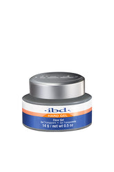 Full front view of a 0.5 ounce plastic tub of ibd UV Clear Gel with twist cap on